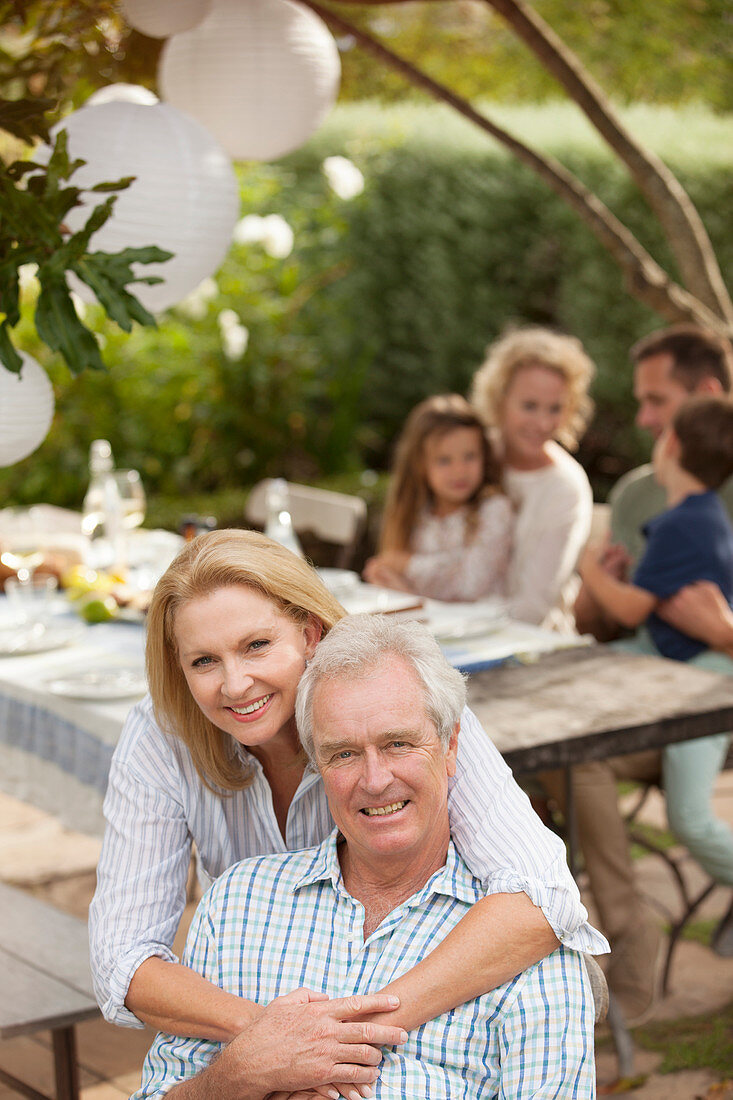 Smiling senior couple on patio