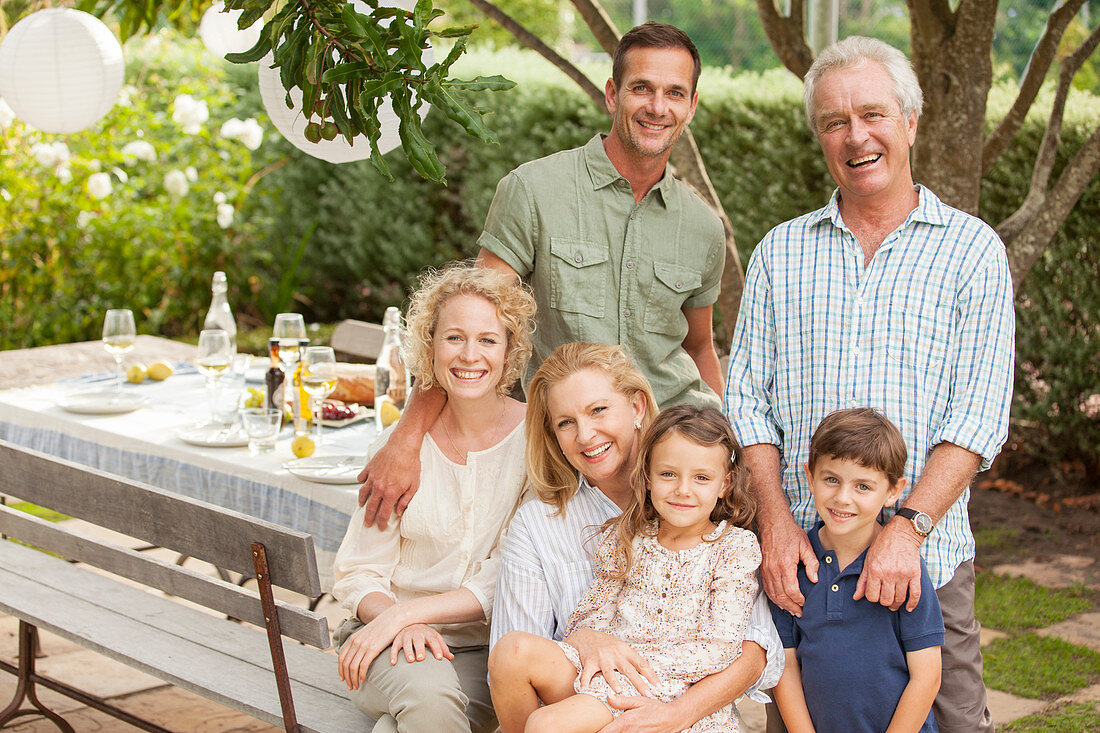 Smiling multi-generation family at table