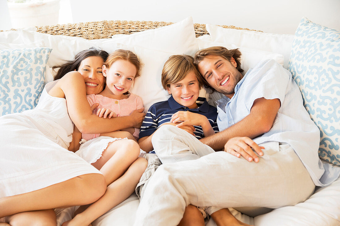 Family relaxing together on sofa