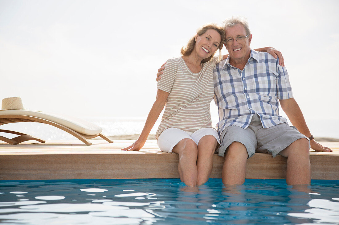 Senior couple dipping feet