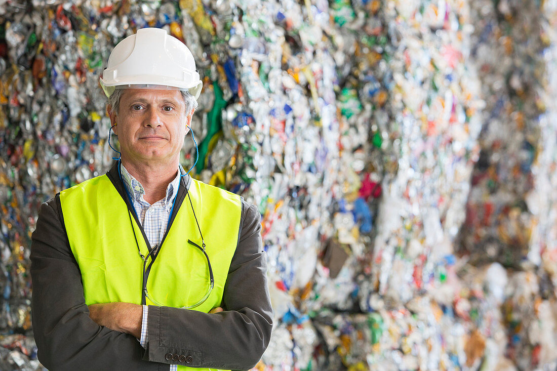 Supervisor standing in recycling plant