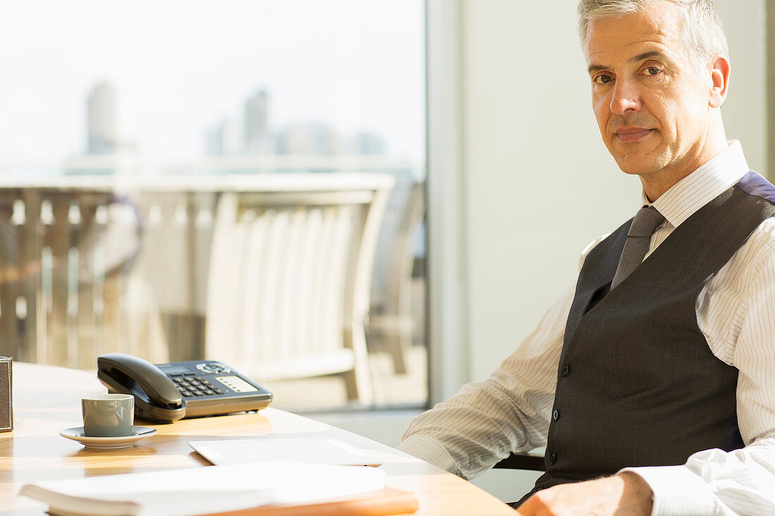 Businessman sitting at desk in office