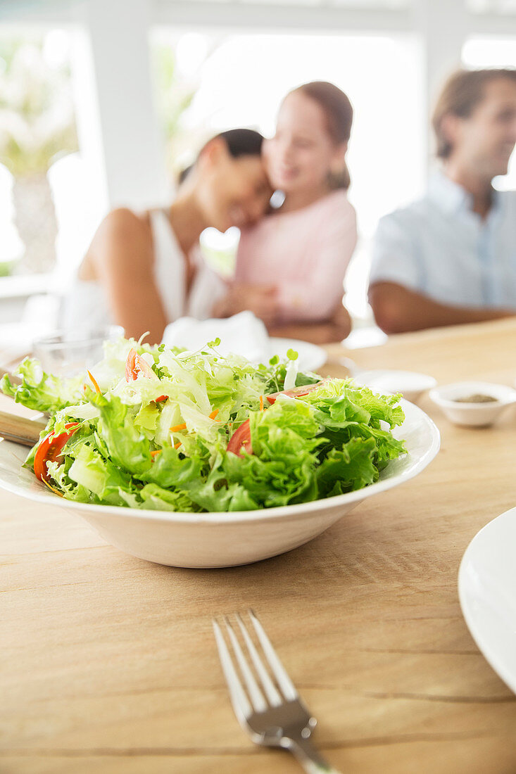 Close up of bowl of salad on table
