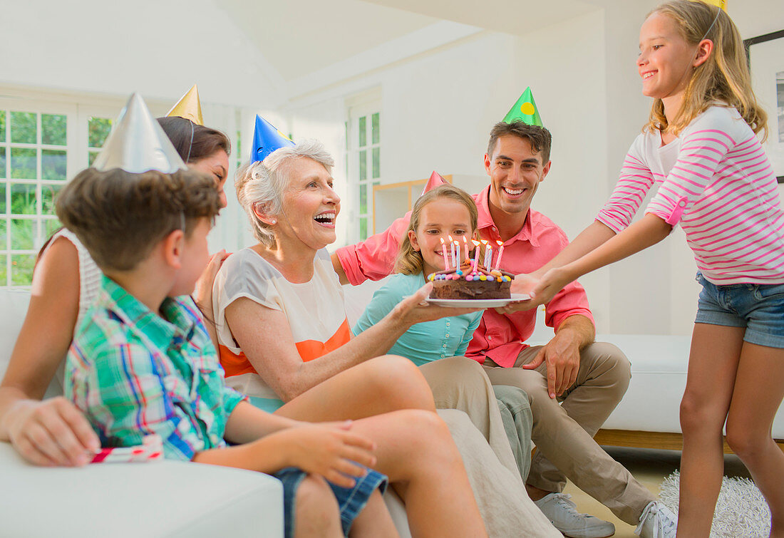 Family celebrating older woman's birthday