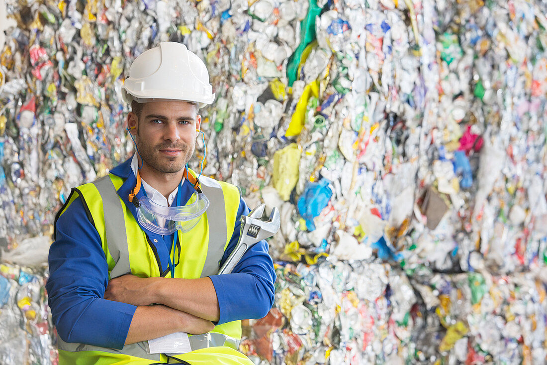 Worker by compacted recycling bundles