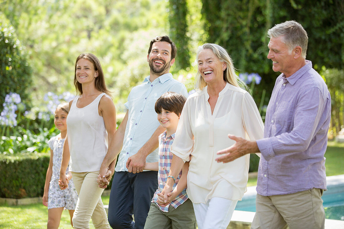 Family walking in backyard