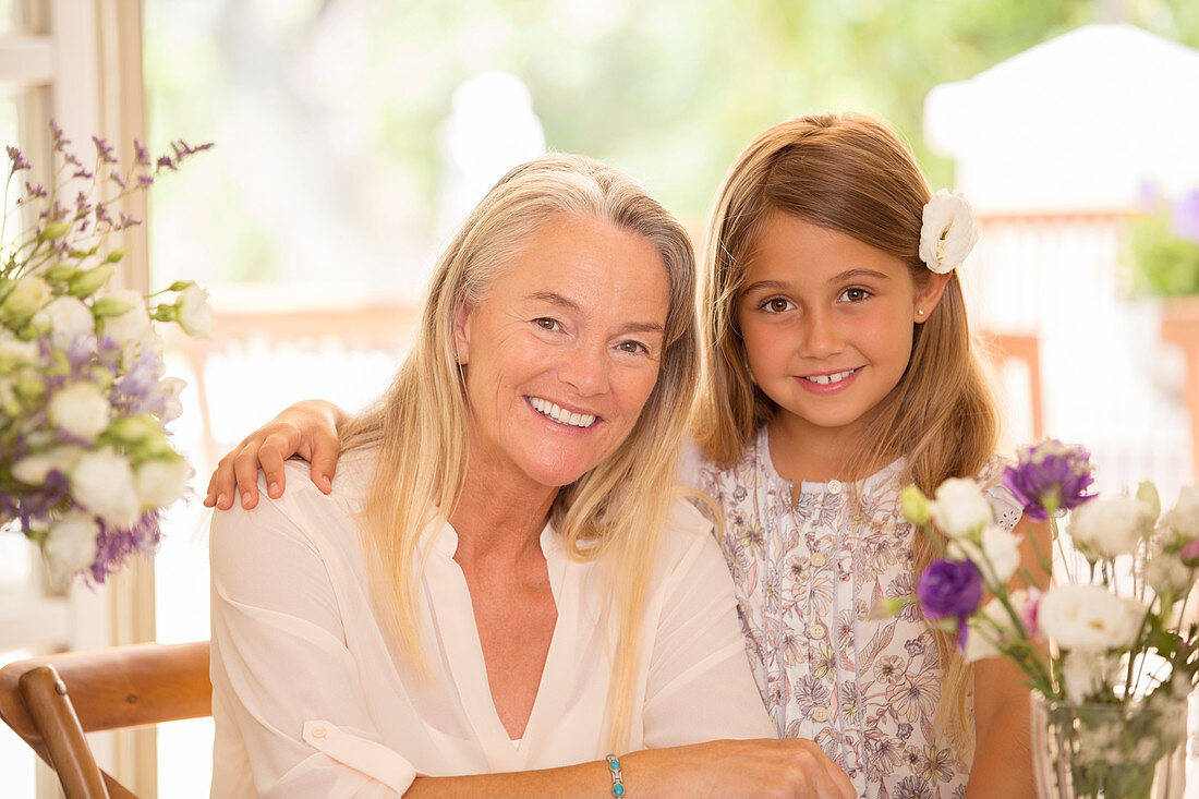 Grandmother and granddaughter smiling