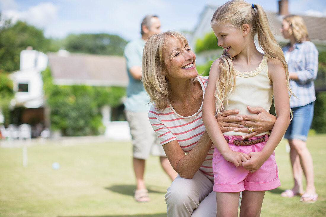 Grandmother hugging granddaughter