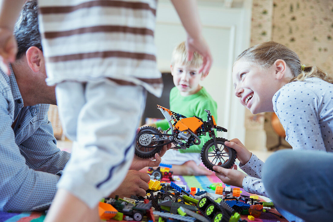 Father and children playing together