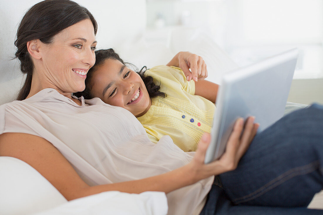 Mother and daughter using tablet