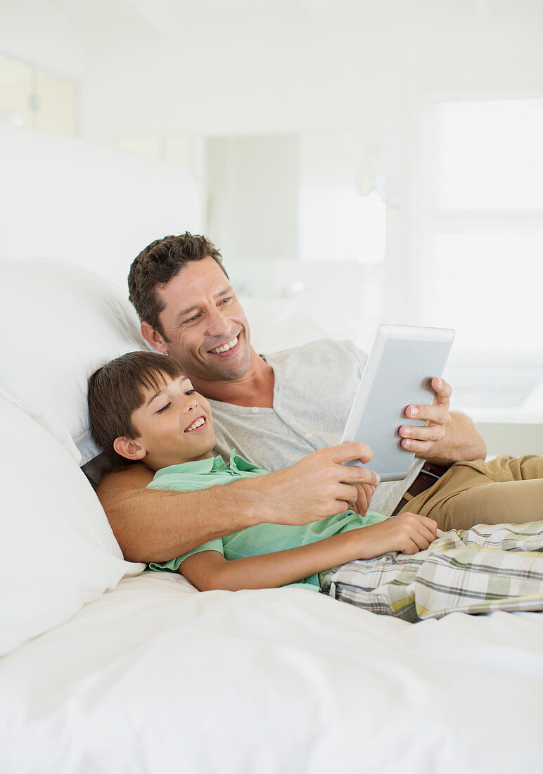 Father and son using tablet