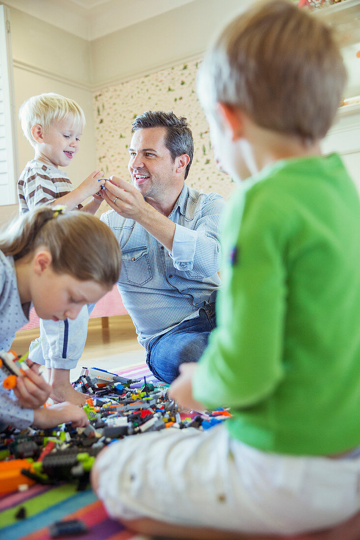 Father playing with children