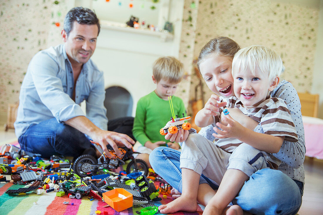 Father and children playing together