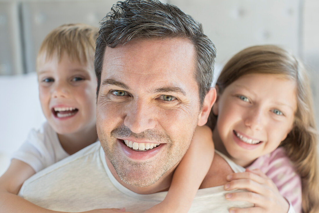 Father and children hugging