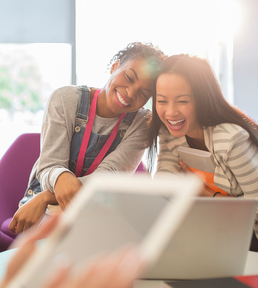 University students laughing in lounge