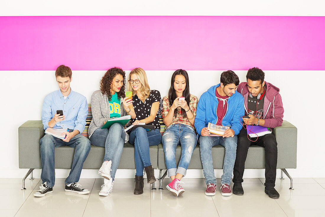 University students sitting on bench