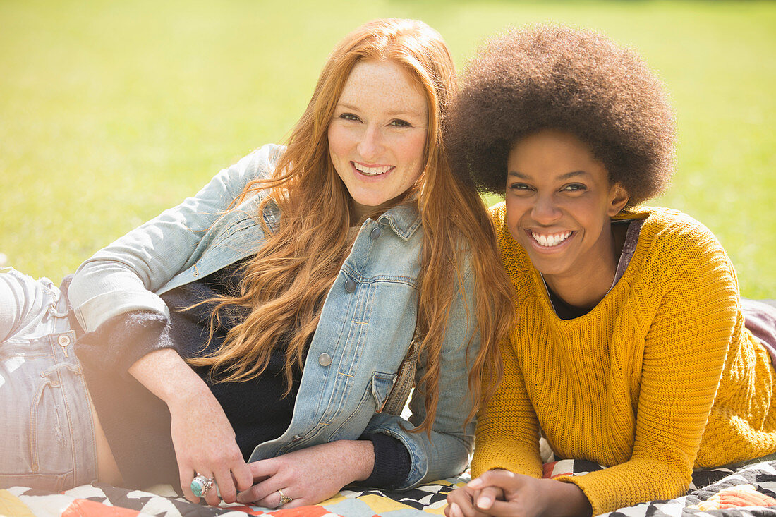 Women relaxing together in park