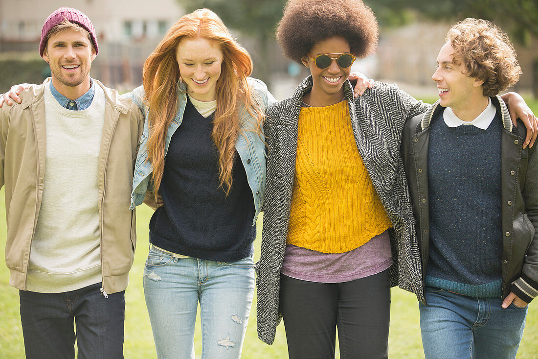 Friends walking together in park