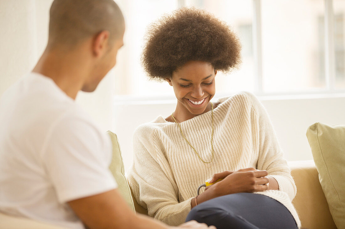 Couple relaxing together on sofa