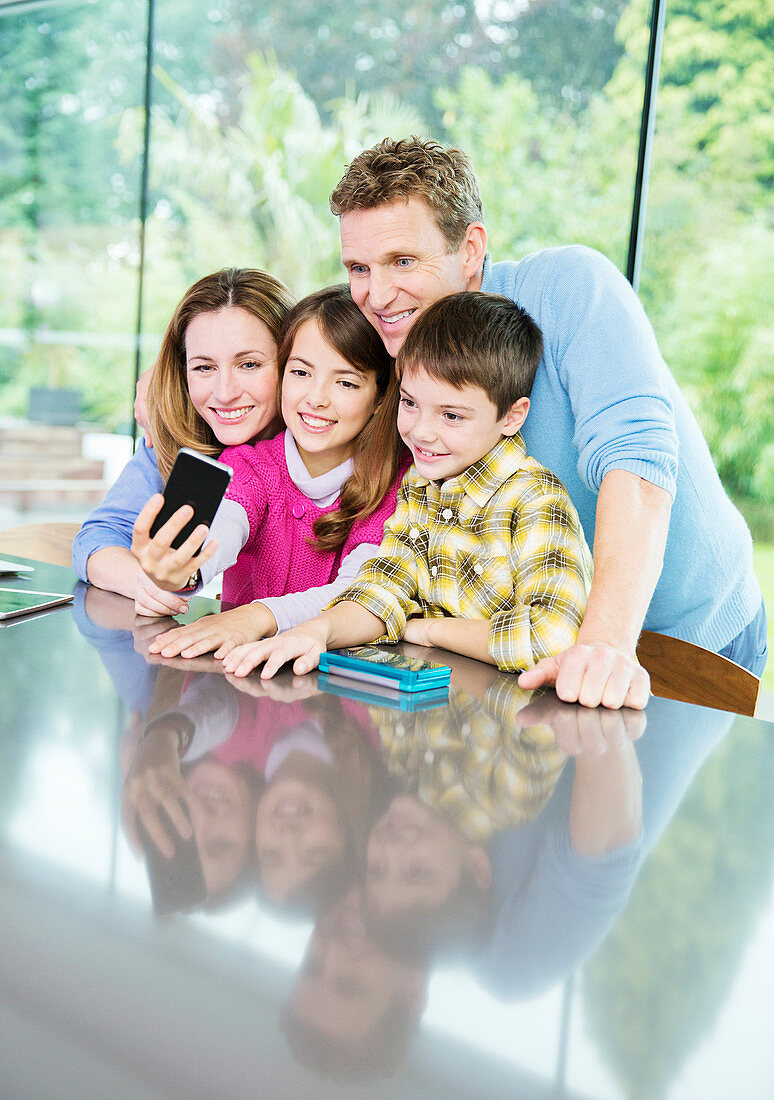 Family taking cell phone picture together