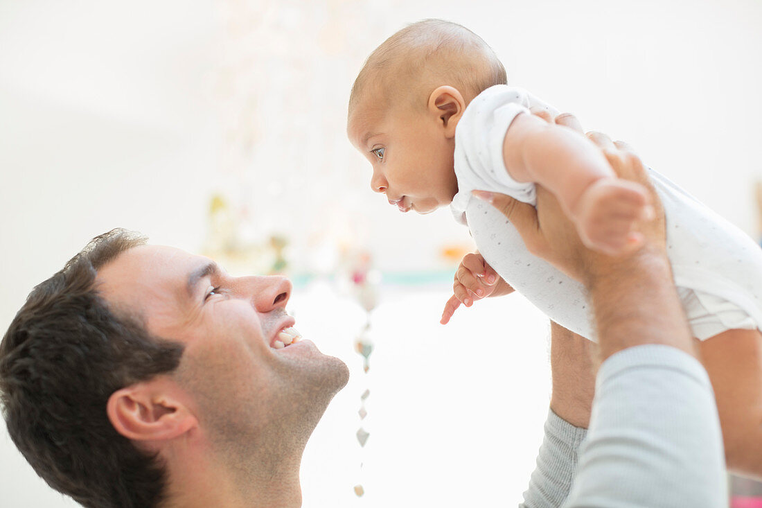 Father playing with baby boy