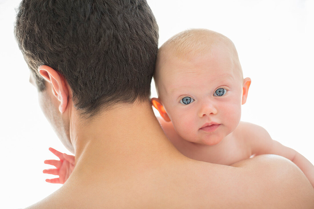 Father carrying baby girl