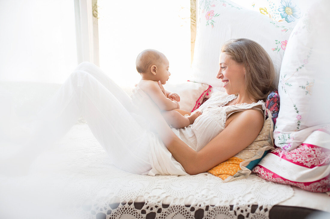 Mother playing with baby boy