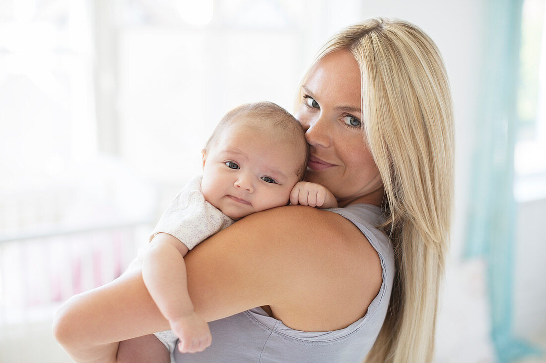 Mother holding baby girl