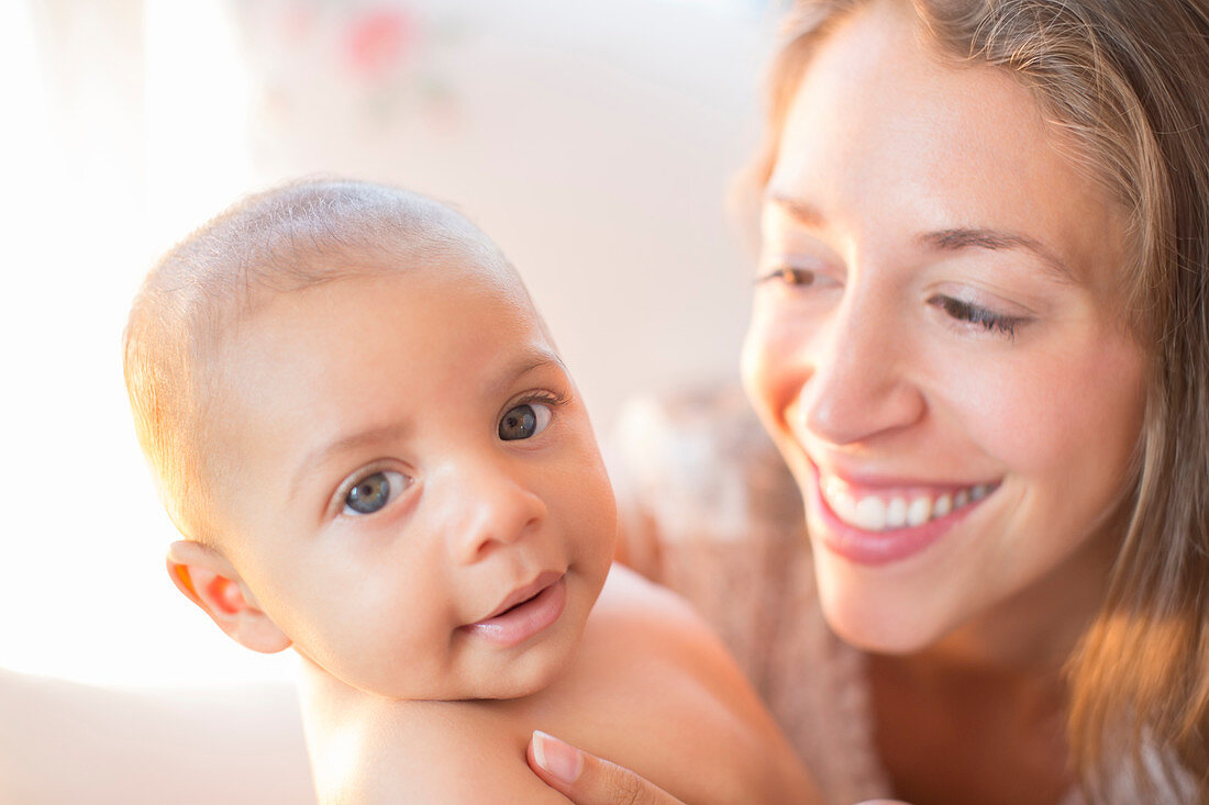 Mother smiling at baby boy