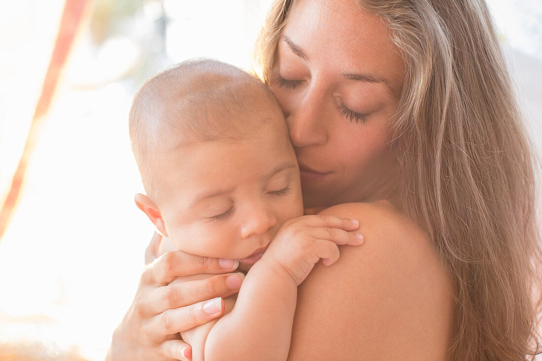 Mother holding baby boy