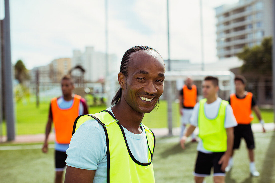 Soccer player smiling on field