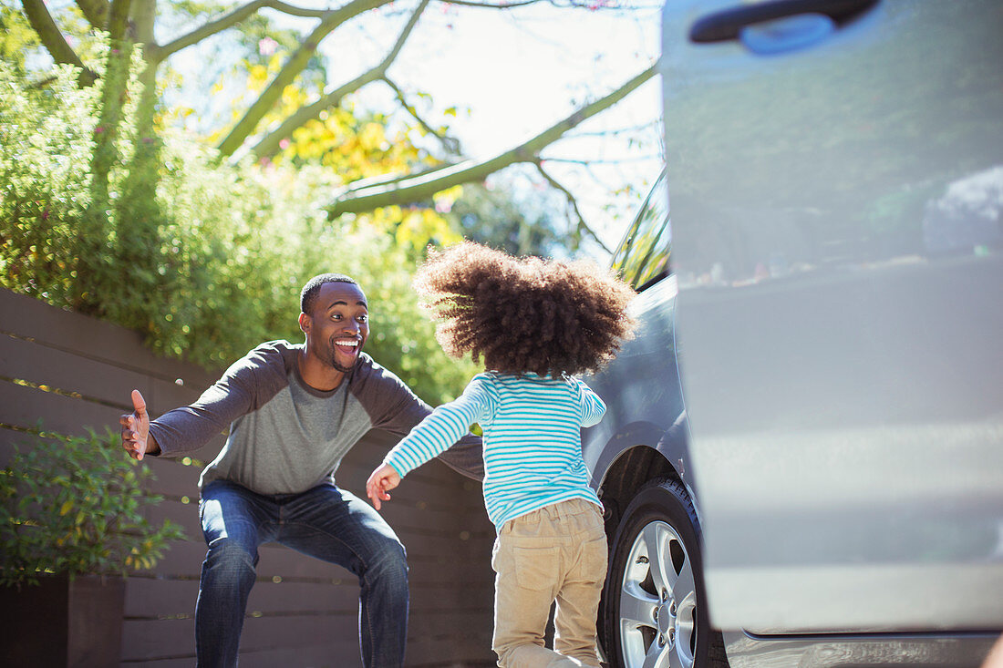 Enthusiastic father greeting daughter