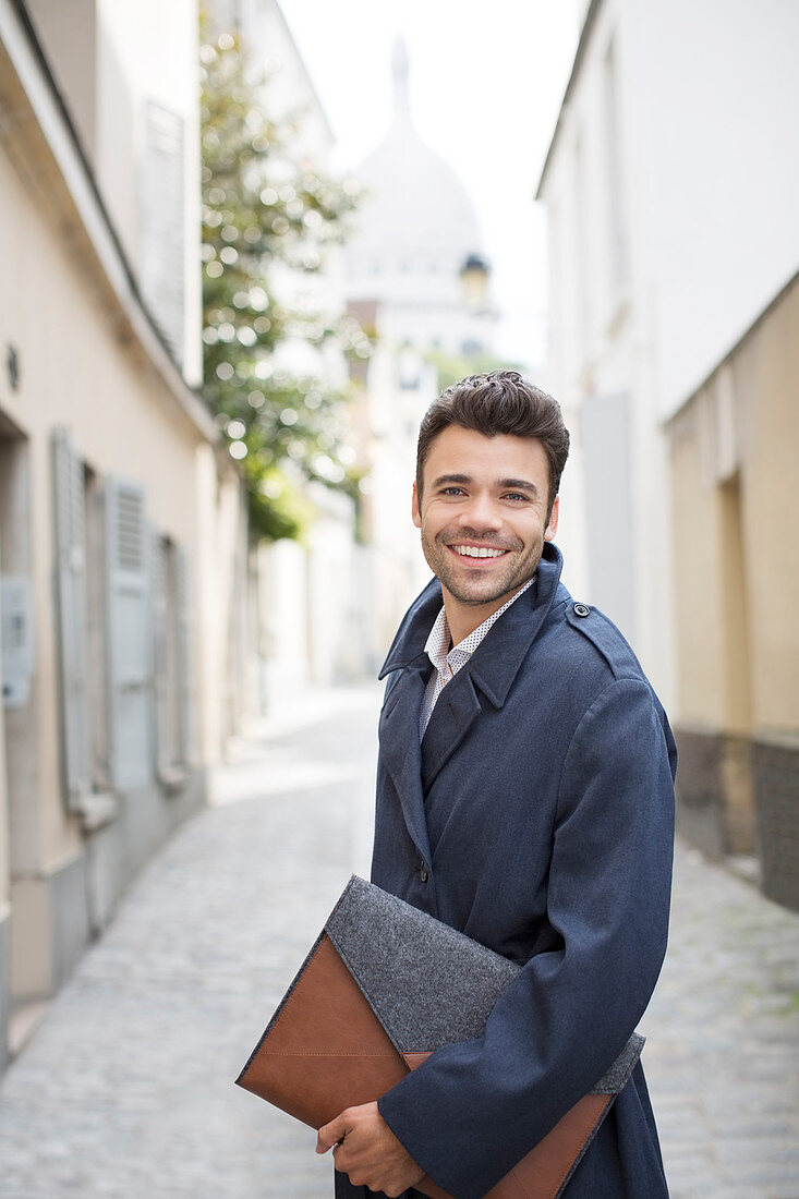 Businessman smiling on street in Paris