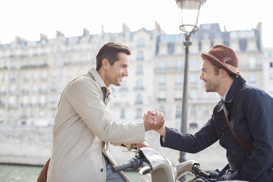 Businessmen shaking hands in Paris