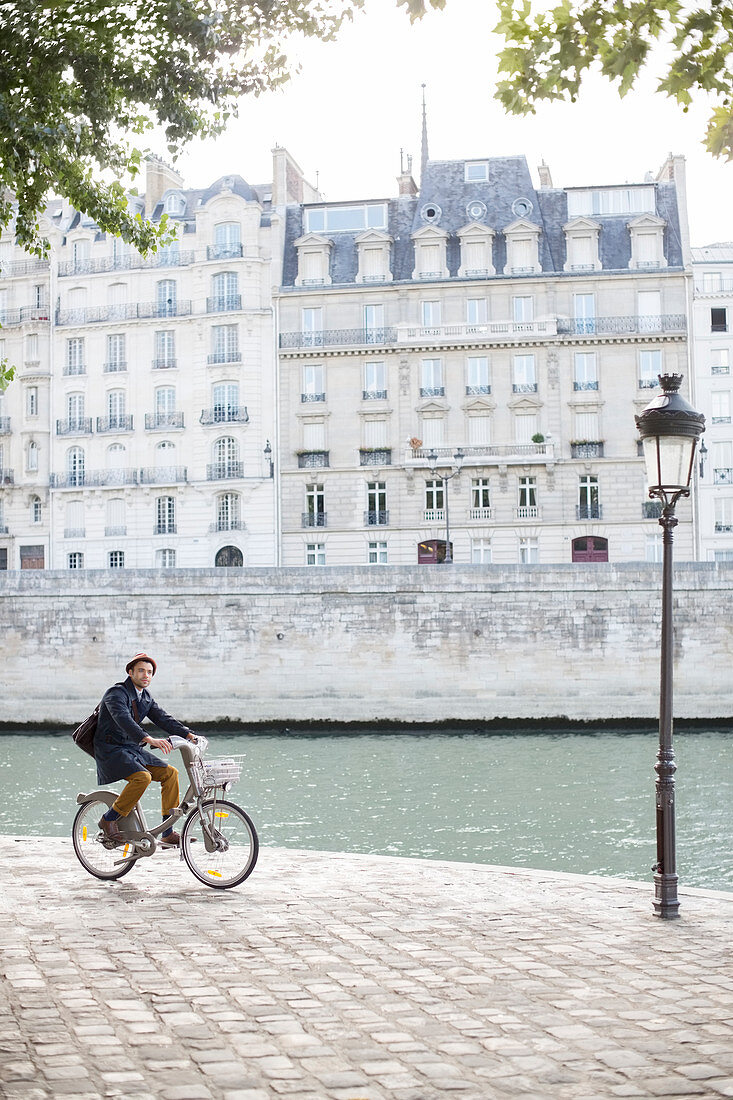 Man riding bicycle in Paris