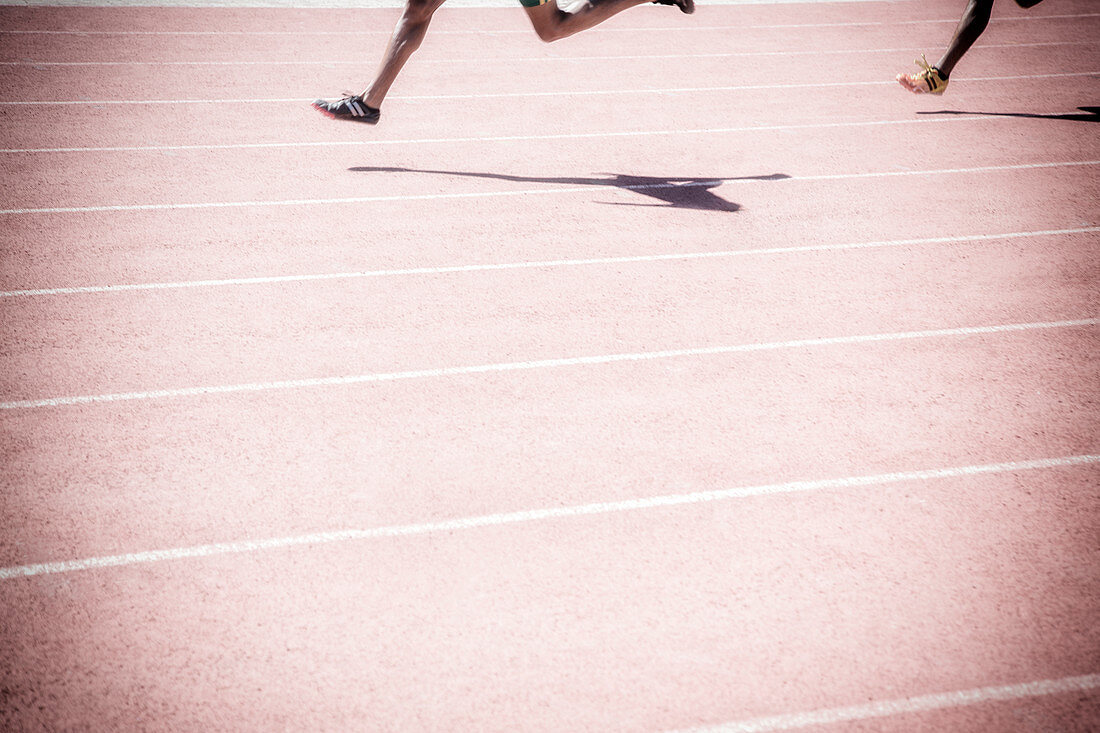 Runners racing on track