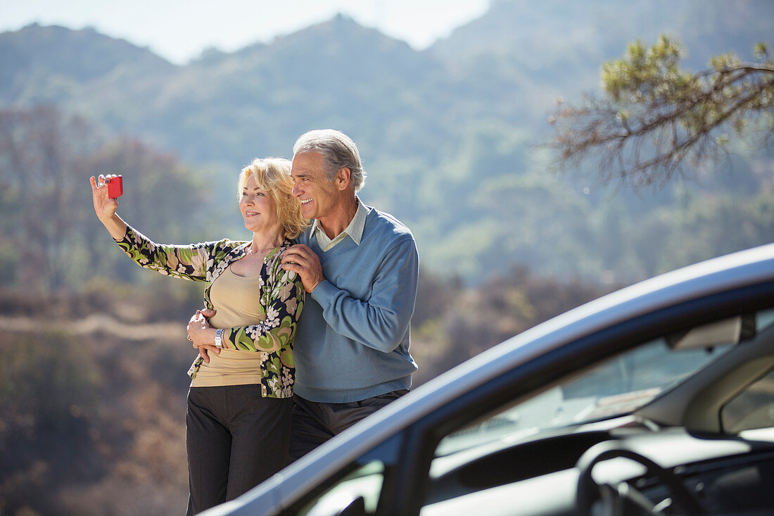 Senior couple taking self-portrait