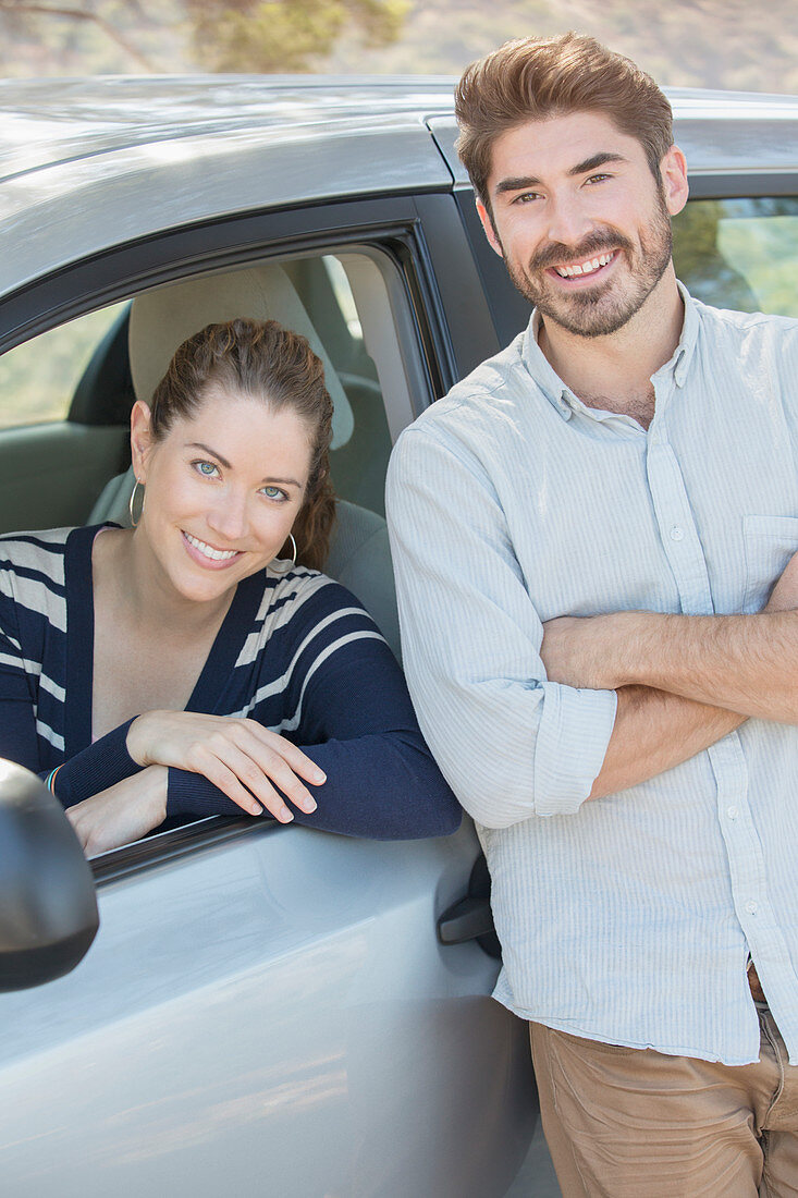 Portrait of smiling couple inside and