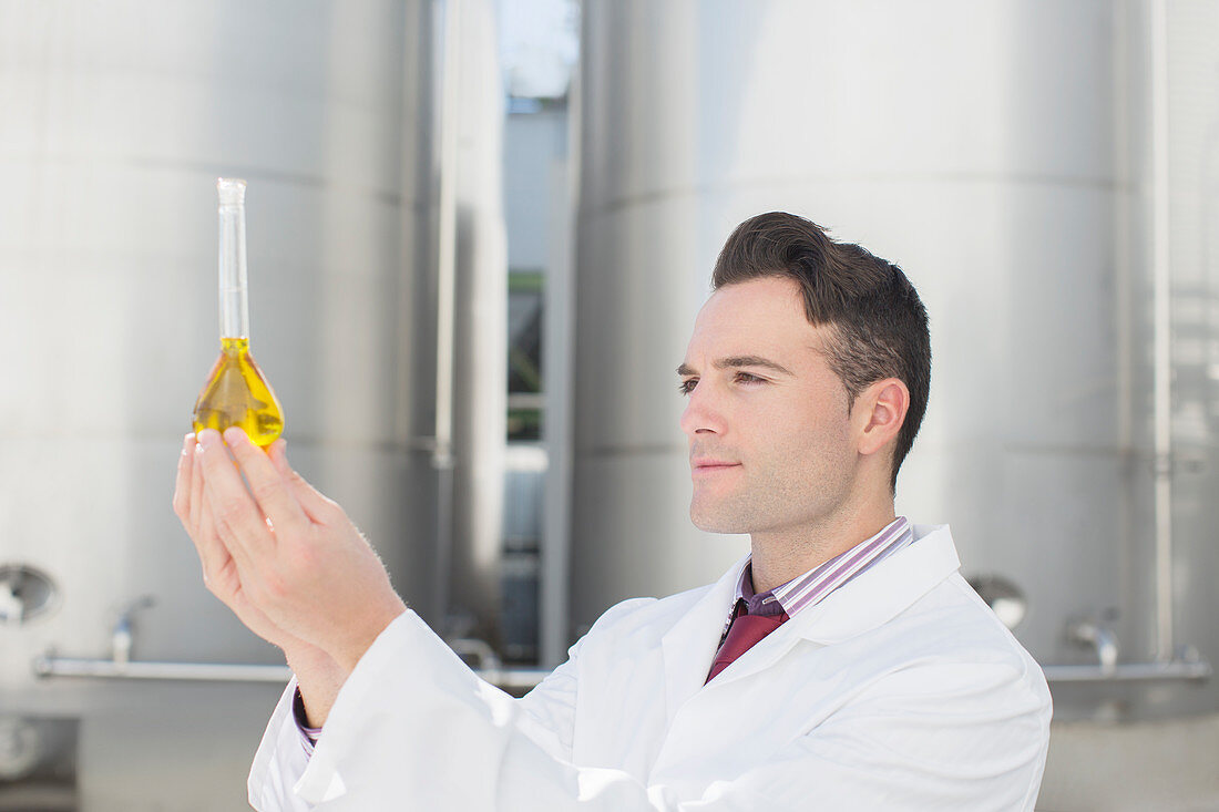 Scientist examining liquid in beaker