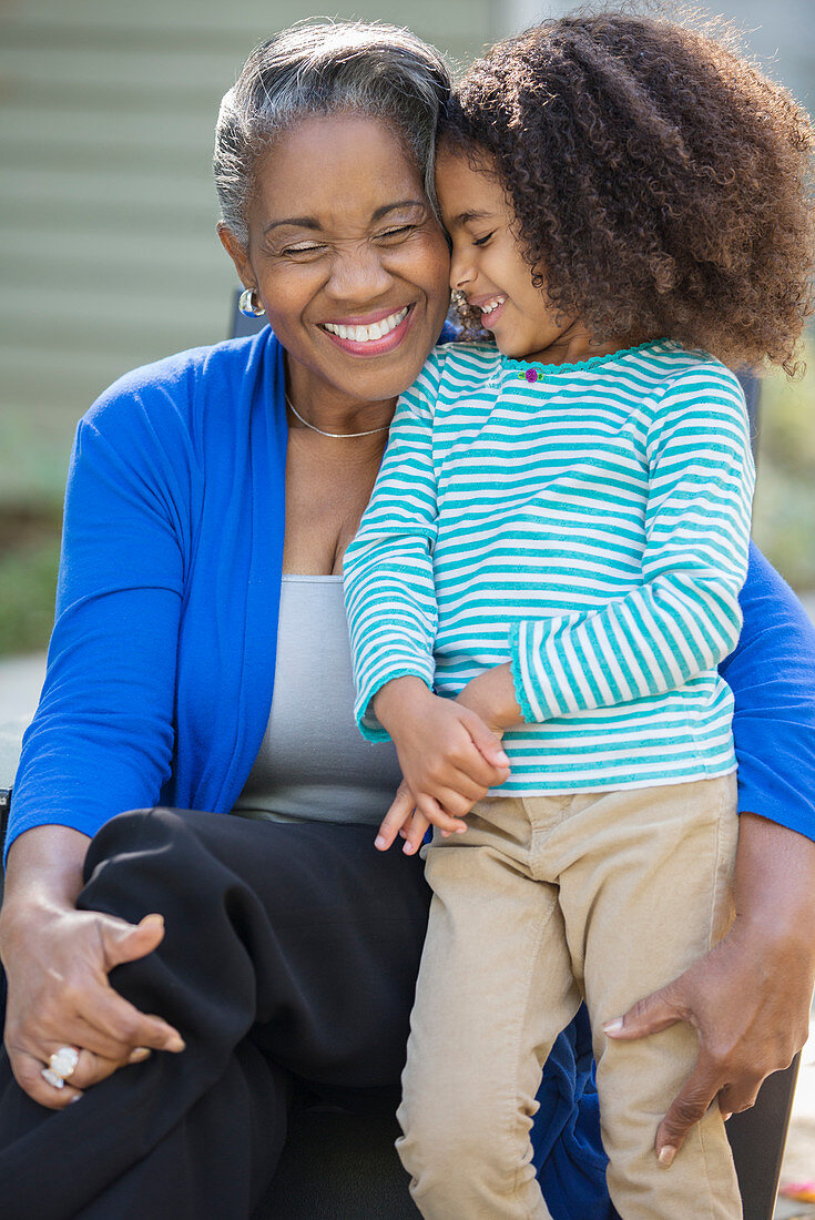 Smiling grandmother and granddaughter