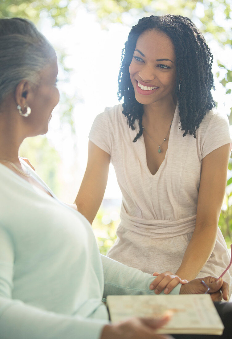 Happy mother and daughter talking