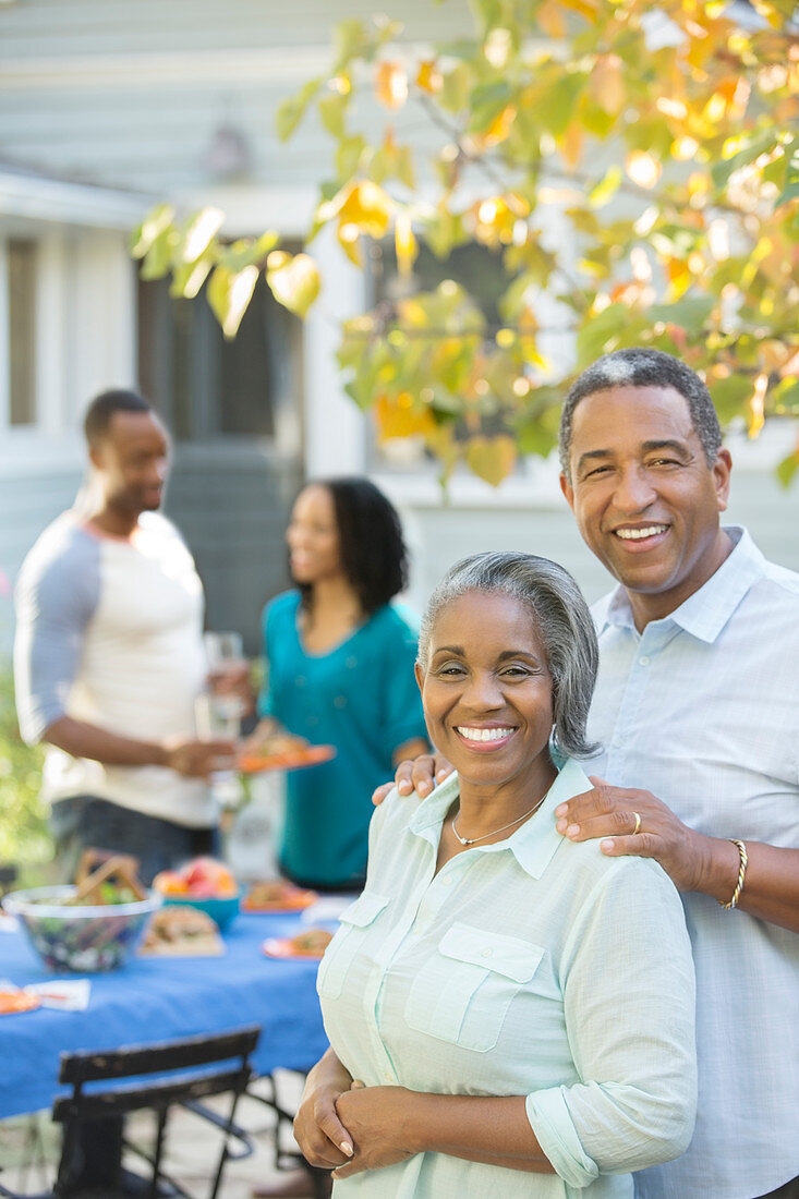 Smiling senior couple at barbecue