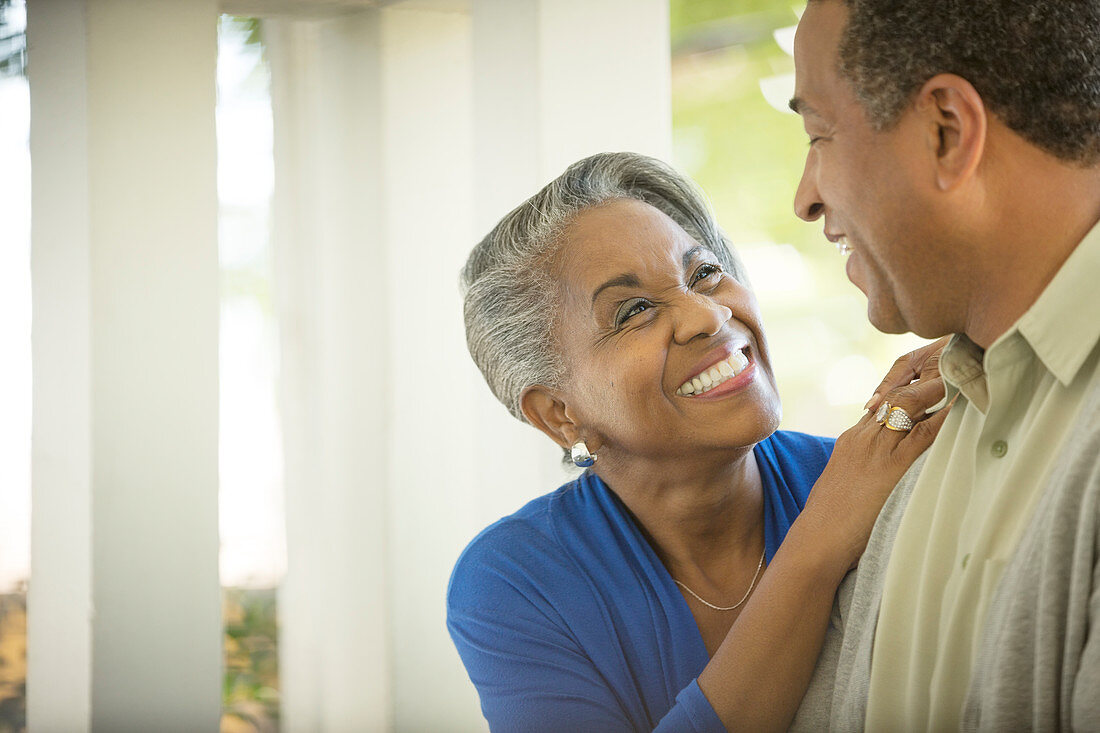 Enthusiastic senior couple hugging