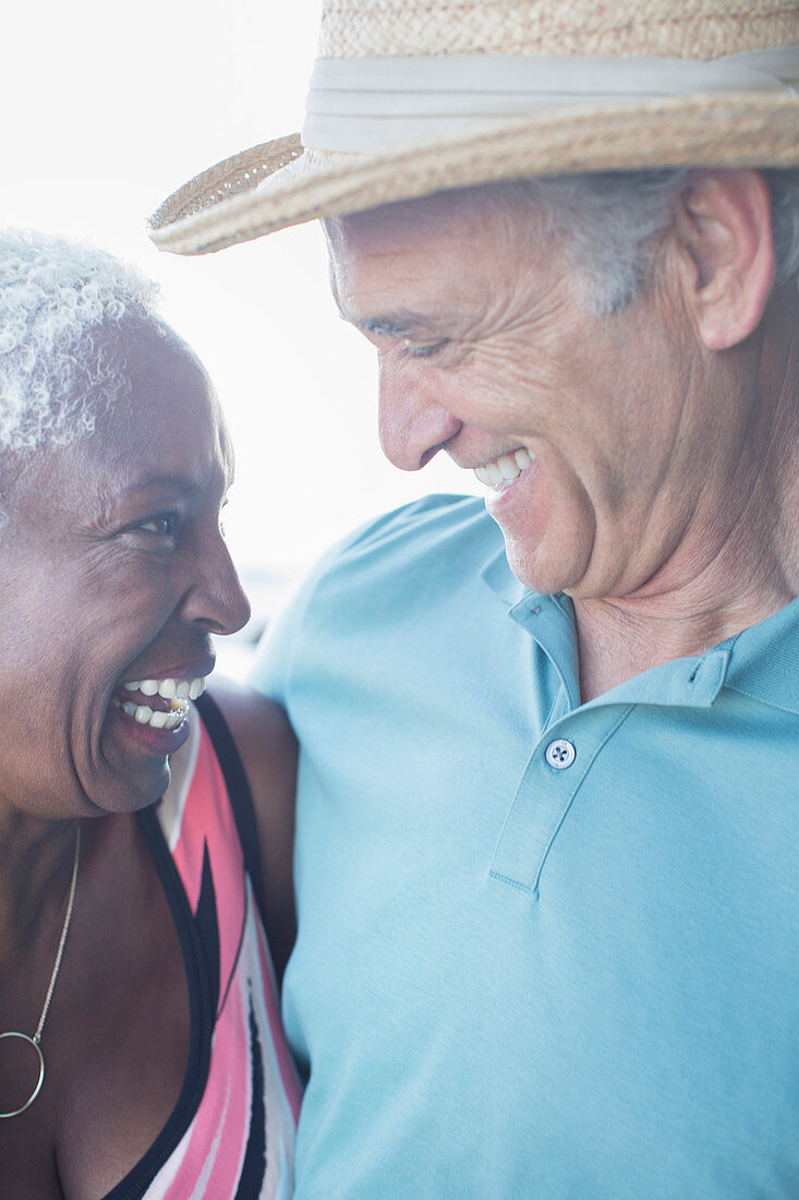 Close up of happy couple hugging