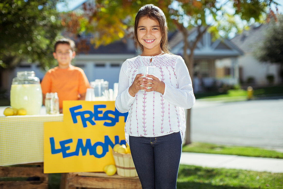 Smiling girl at lemonade stand