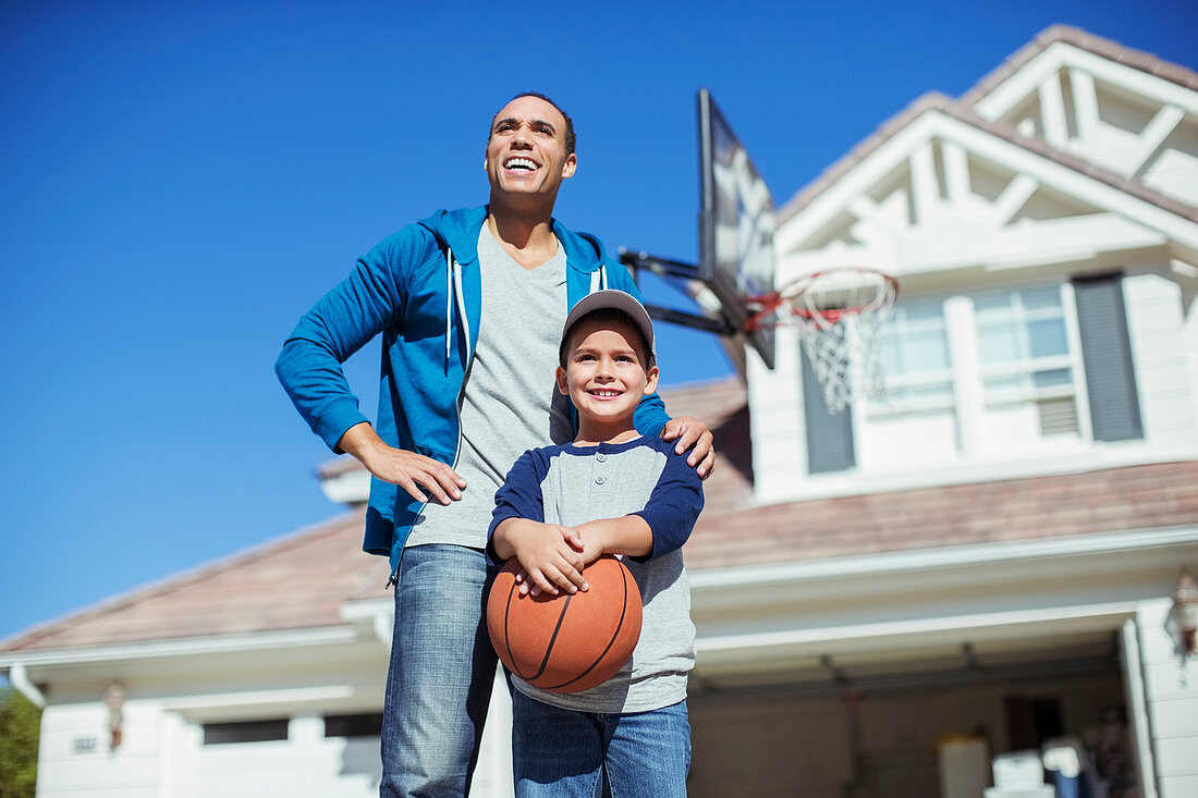 Father and son with basketball