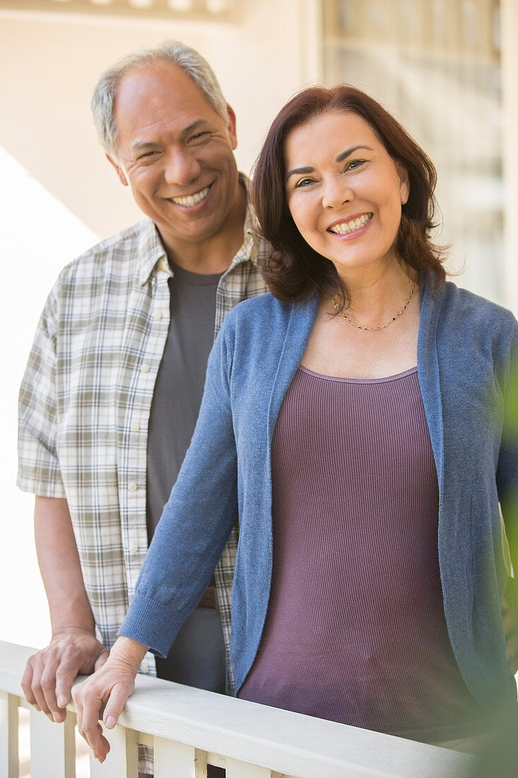 Portrait of smiling couple on porch