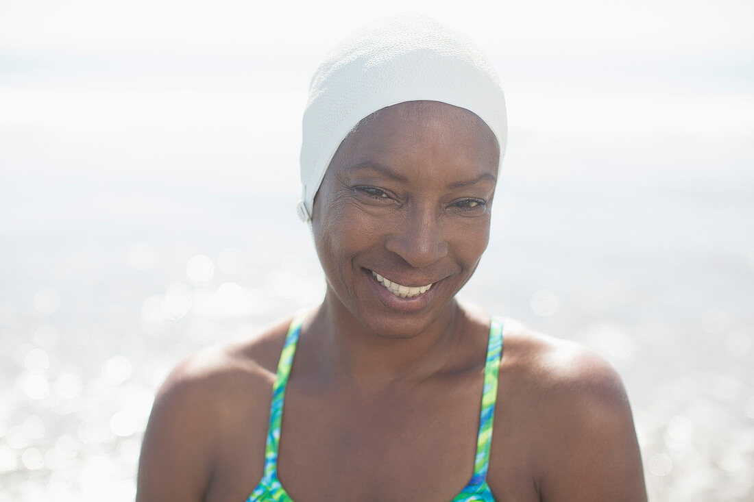 Woman in swimming cap at beach