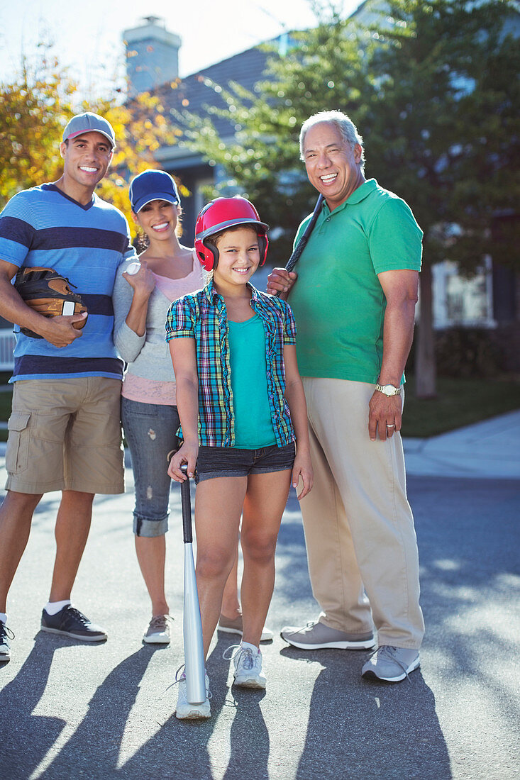 Happy Family playing baseball in street