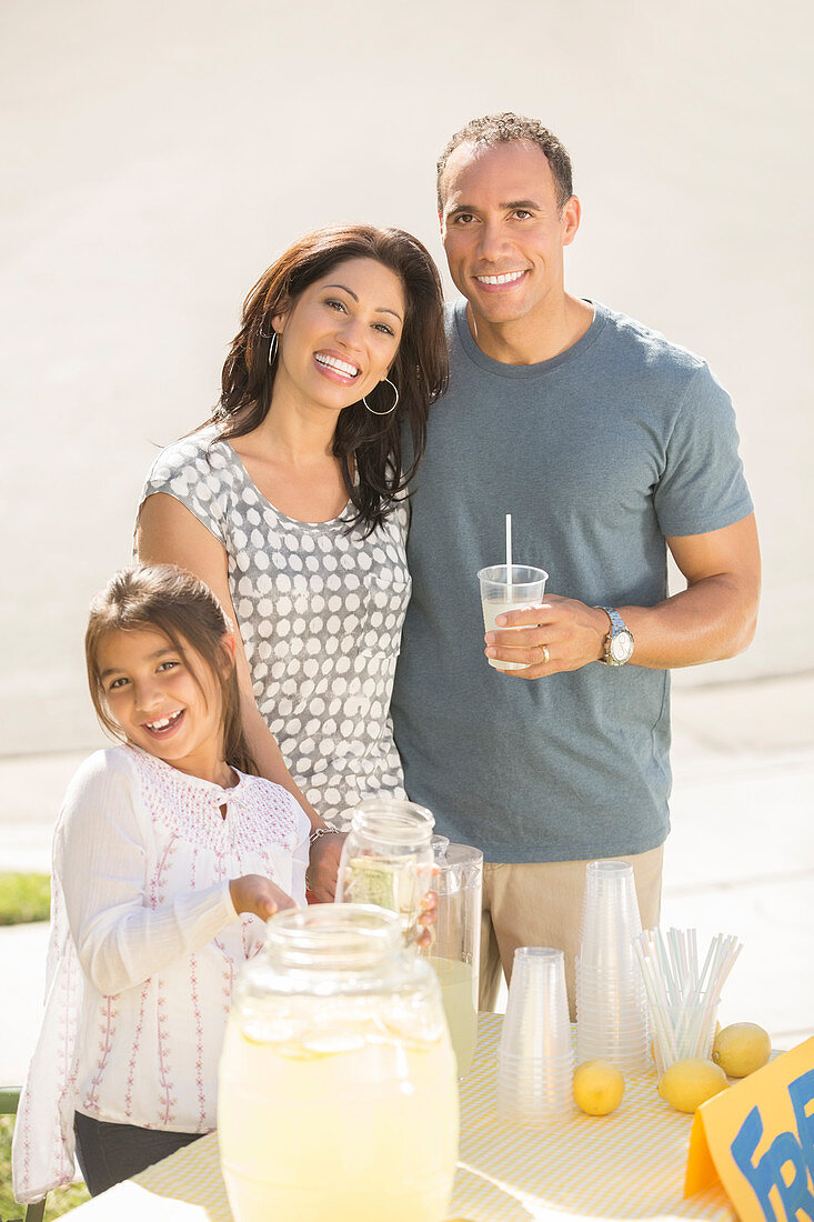 Smiling family at lemonade stand